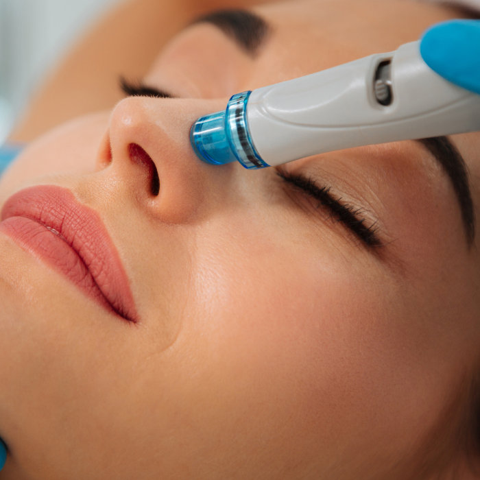 Women Getting a facial with a tool